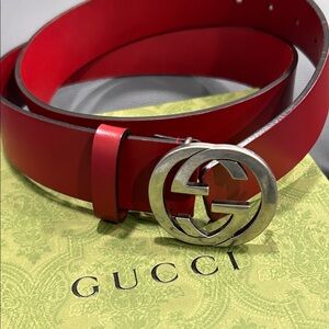 Vibrant Red Belt with Iconic Silver Buckle